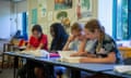 Children in a classroom reading.