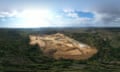 Aerial image of a construction site in a forest clearing