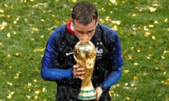 Antoine Griezmann plants a kiss on the World Cup trophy after France beat Croatia in the 2018 final in Russia.