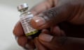 A pharmacist holds a vial of lenacapavir in his hand