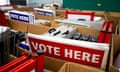 red, white and blue 'vote here' signs