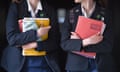 Students walk along a corridor carrying books at Royal High School Bath private school