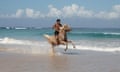 Carlos from the Sanubari stables rides half Sumba, half Arab racing horse Calypso along the beach, Sumba, Indonesia