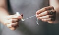 Closeup of woman's hands holding a tampon