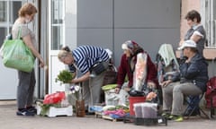 Russian pensioners sell homegrown vegetables, fruit and flowers to support themselves in Podolsk, Moscow region.