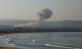 Smoke billows over southern Lebanon following an Israeli strike, as seen from Tyre, Lebanon.