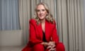 Jennifer Salke in a red suit poses seated for a photograph