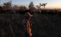 Riley Swanson, 19, watching over the herd at first light.